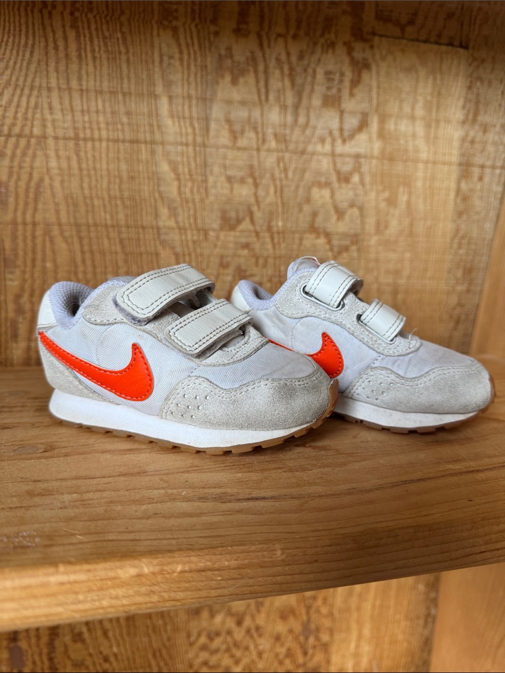 Nike Kids White Sneakers with Bright Orange Swoosh